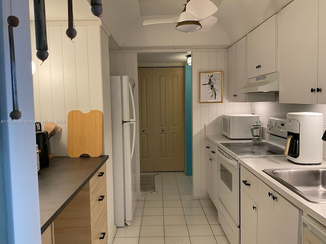 kitchen with white cabinets, hanging light fixtures, white appliances, and exhaust hood