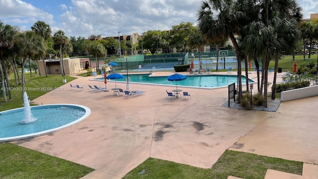 view of pool featuring a yard and a patio area