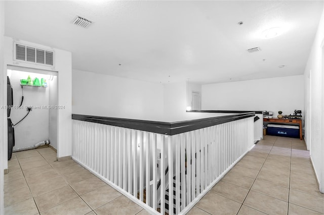 hallway with light tile patterned flooring