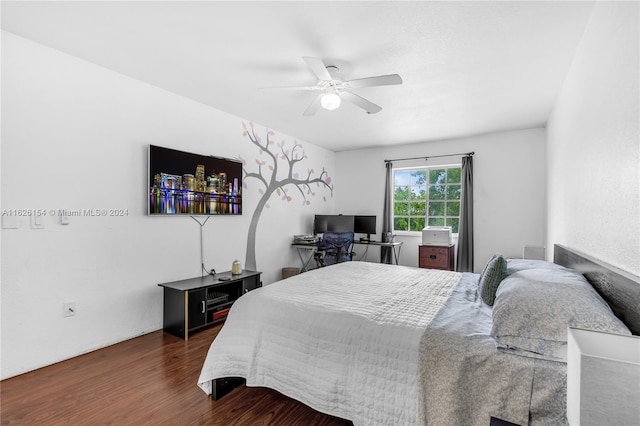 bedroom featuring dark hardwood / wood-style floors and ceiling fan