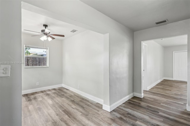 empty room featuring hardwood / wood-style flooring and ceiling fan