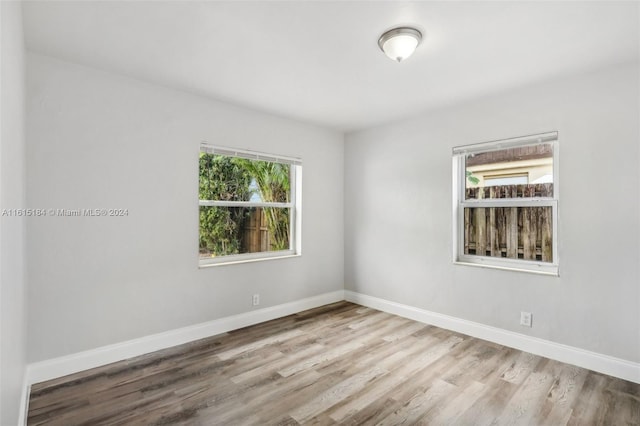 spare room featuring light hardwood / wood-style floors