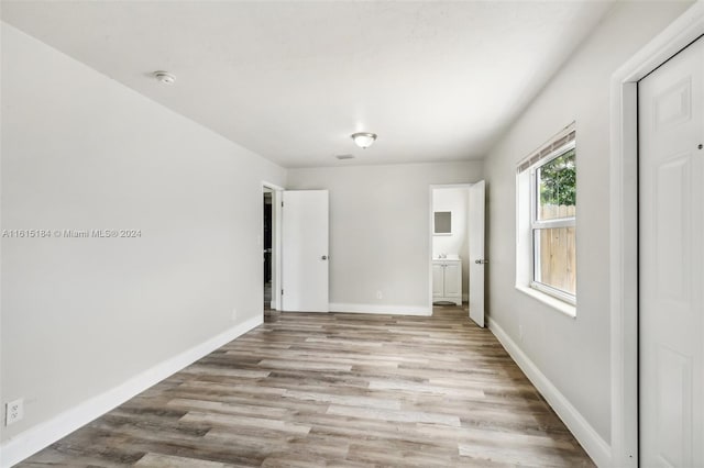 unfurnished bedroom with light wood-type flooring