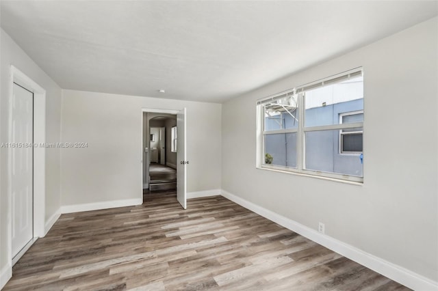 spare room featuring light hardwood / wood-style floors