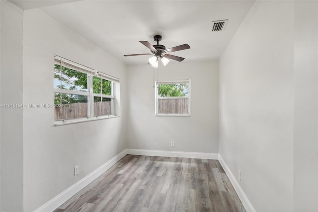 unfurnished room with ceiling fan and light wood-type flooring