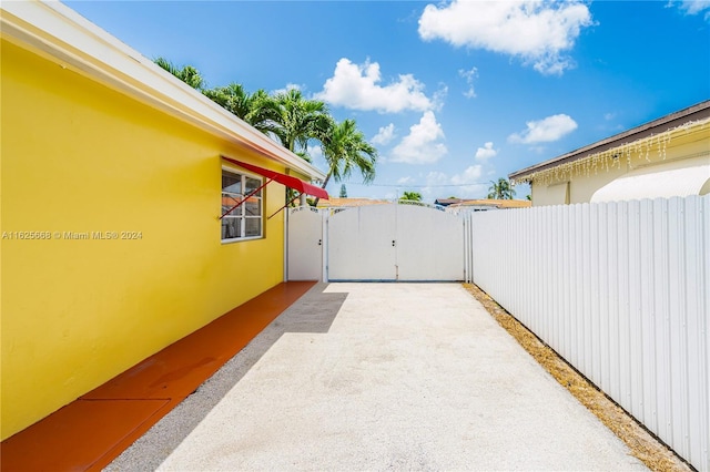 view of patio / terrace with fence and a gate