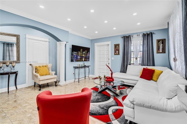 living room with baseboards, ornate columns, recessed lighting, arched walkways, and crown molding