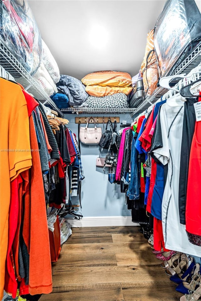 spacious closet featuring wood finished floors