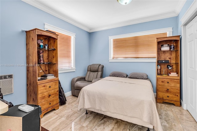 bedroom with baseboards and ornamental molding