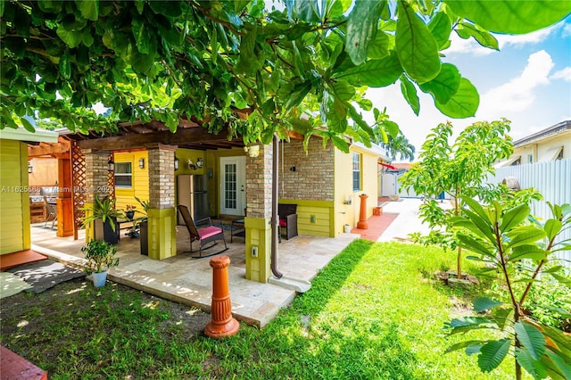 view of yard with a patio and fence