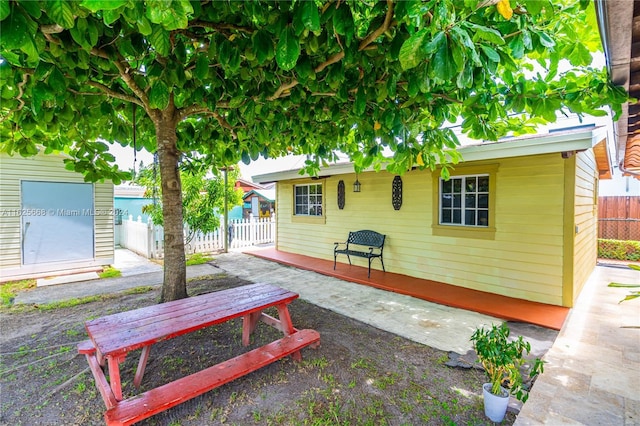 view of patio featuring fence