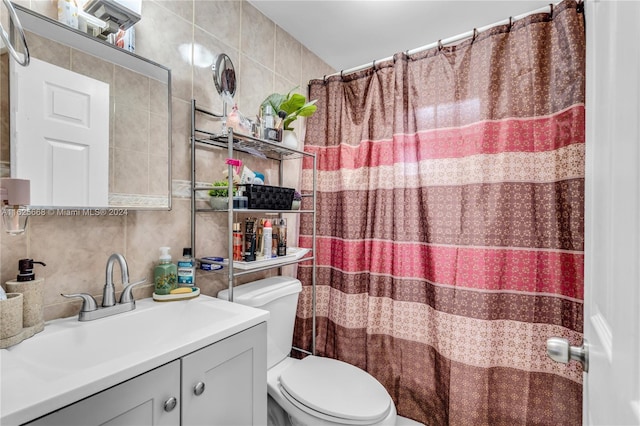 bathroom with vanity, a shower with curtain, tile walls, toilet, and tasteful backsplash