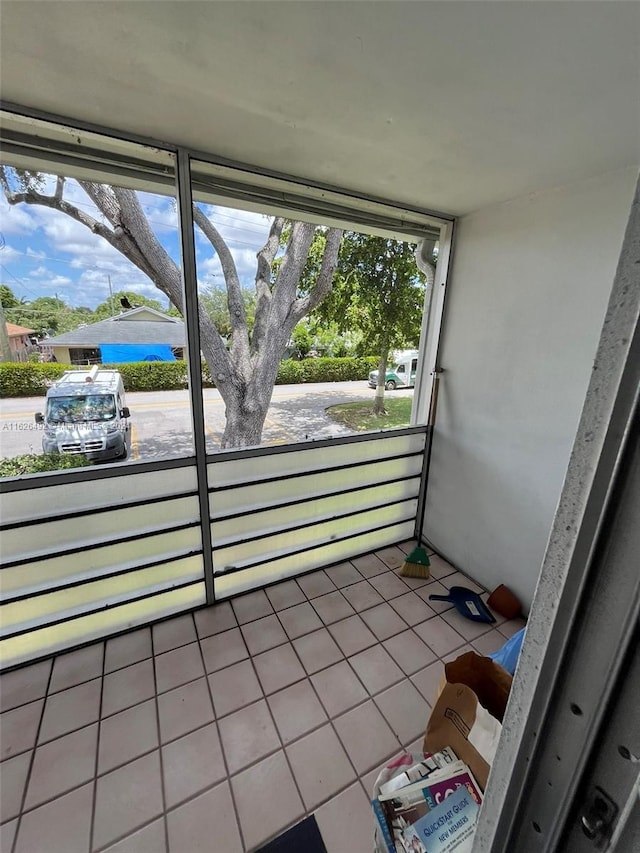 unfurnished sunroom featuring plenty of natural light