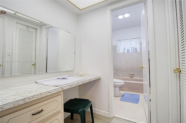 full bathroom with vanity, shower / bath combination with curtain, and toilet