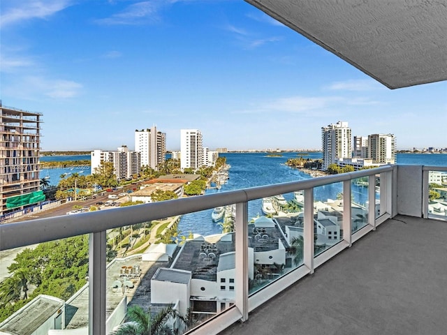 balcony featuring a water view