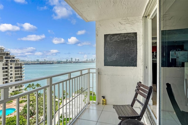 balcony featuring a water view