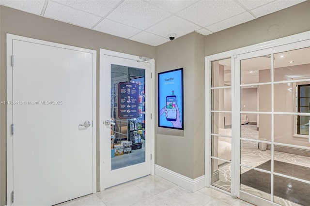 entryway with french doors and a drop ceiling