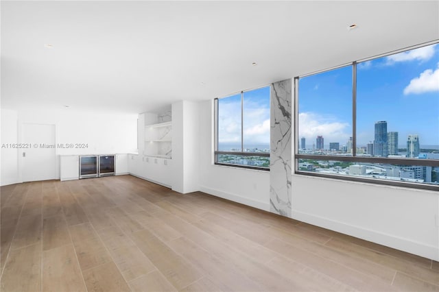 unfurnished living room featuring light hardwood / wood-style flooring