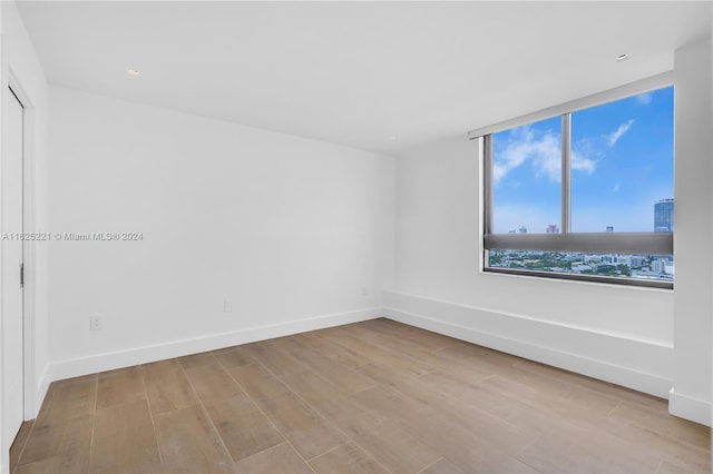 spare room with light hardwood / wood-style floors