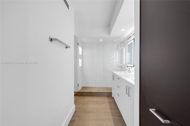 bathroom featuring a wealth of natural light and vanity