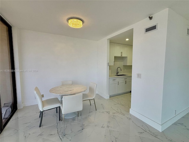 dining room featuring sink