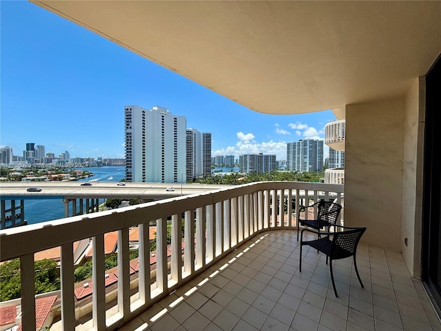 balcony featuring a water view