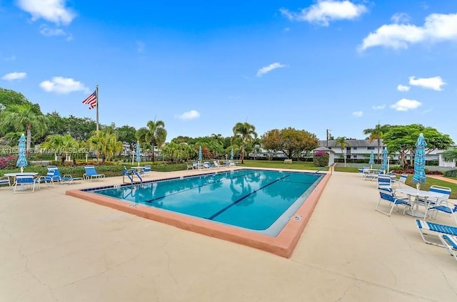 view of swimming pool with a patio area