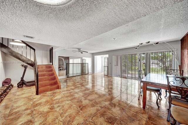 interior space featuring ceiling fan