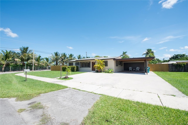 ranch-style home with a front lawn and a carport