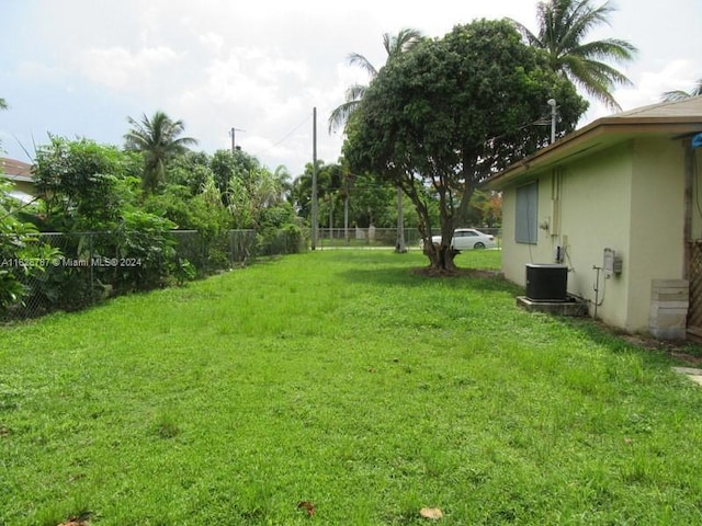 view of yard featuring central air condition unit