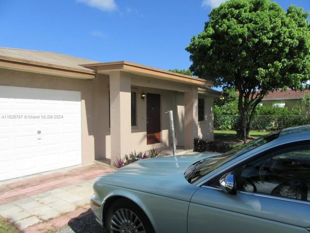 view of side of home with a garage