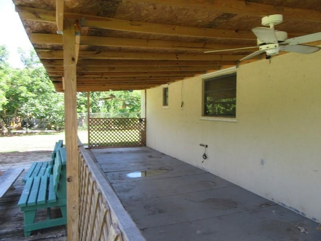 view of patio / terrace featuring ceiling fan and a wooden deck