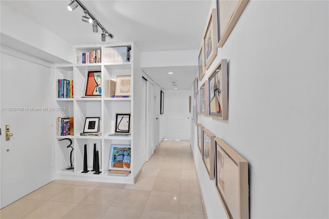 corridor with light tile patterned floors