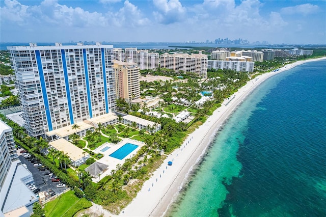 drone / aerial view featuring a view of the beach and a water view