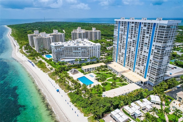 drone / aerial view featuring a view of the beach and a water view