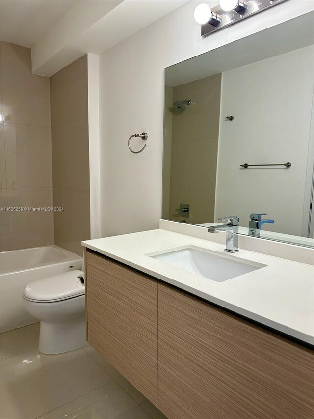 full bathroom featuring vanity, toilet,  shower combination, and tile patterned floors