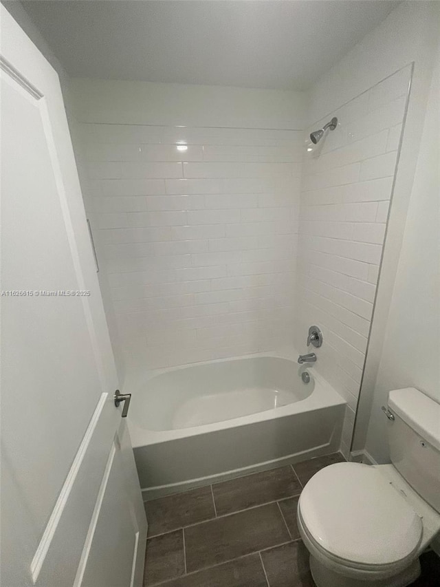 full bath featuring bathtub / shower combination and toilet