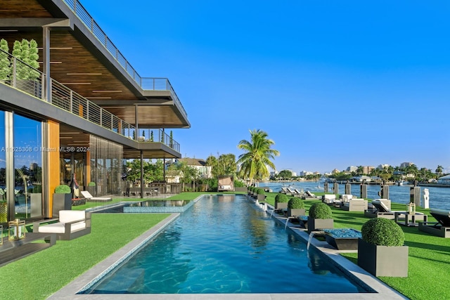 view of swimming pool featuring pool water feature