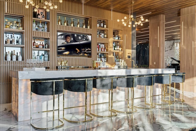 bar featuring a chandelier, wooden ceiling, pendant lighting, built in features, and tile patterned flooring