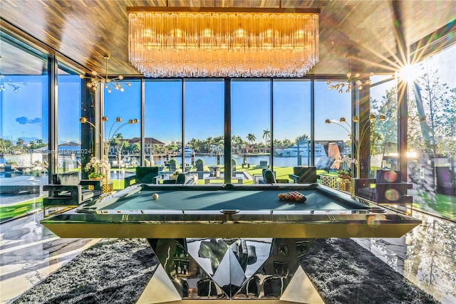 rec room featuring a water view, billiards, and wooden ceiling