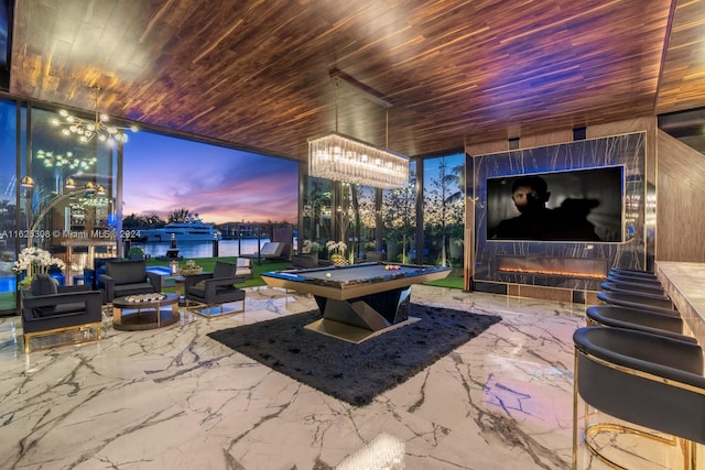 playroom with wood ceiling, a water view, and pool table