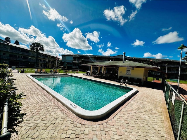 view of swimming pool with a patio