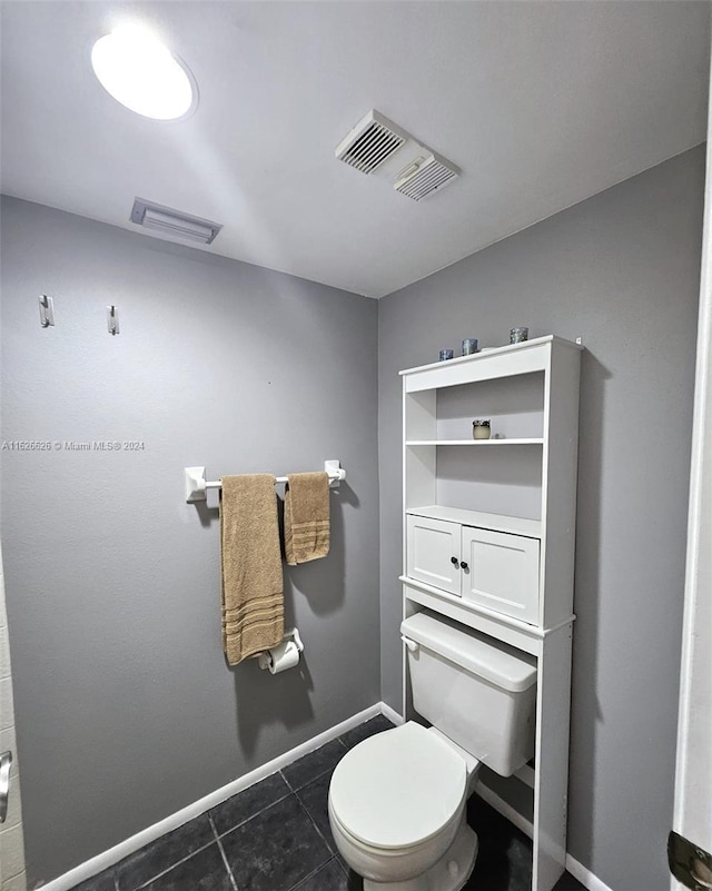 bathroom featuring tile patterned floors and toilet