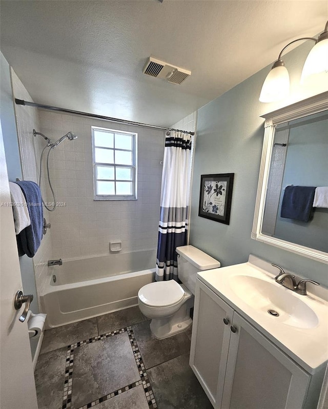 full bathroom with shower / tub combo with curtain, vanity, toilet, and a textured ceiling