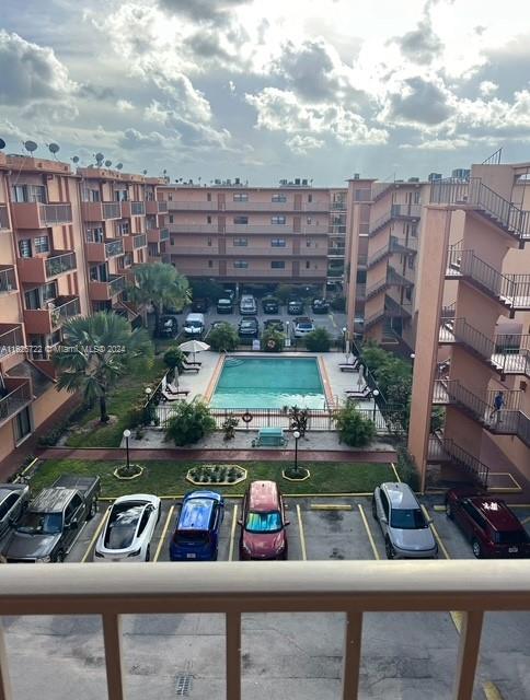 view of building exterior featuring a community pool