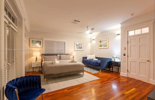 bedroom featuring hardwood / wood-style flooring and ceiling fan