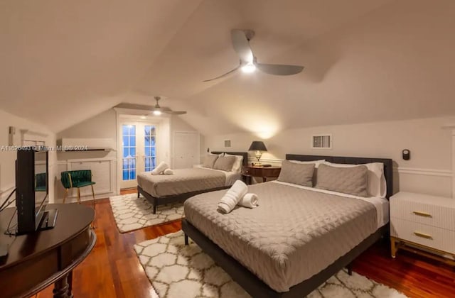 bedroom featuring ceiling fan, wood-type flooring, and lofted ceiling