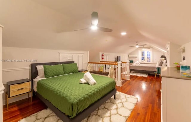 bedroom featuring hardwood / wood-style flooring, lofted ceiling, and ceiling fan