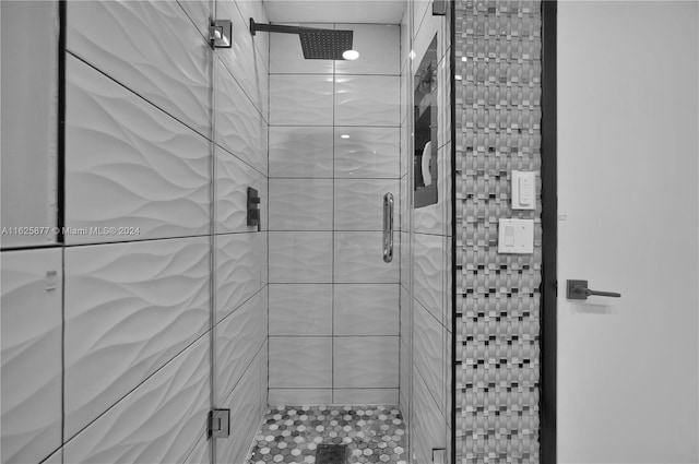 bathroom featuring an enclosed shower