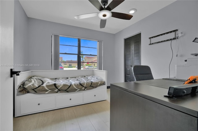 office space with light hardwood / wood-style floors and ceiling fan